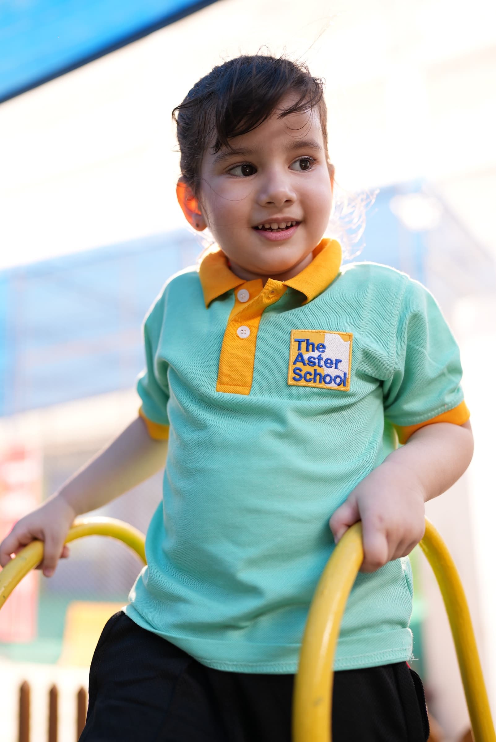 A young learner enjoying the outdoor play area